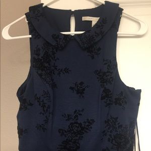 Navy blue dress with black suede flower detail